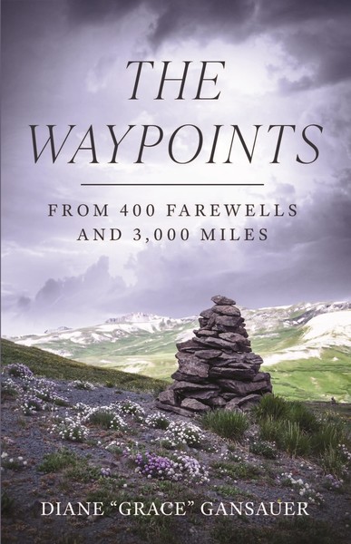 Book cover for The Waypoints: From 400 Farewells and 3,000 Miles by Diane &ldquo;Grace&rdquo; Gansauer, featuring a cairn on a grassy, flower-dotted hill&mdash;one of many waypoints&mdash;set against distant mountains and a cloudy sky.