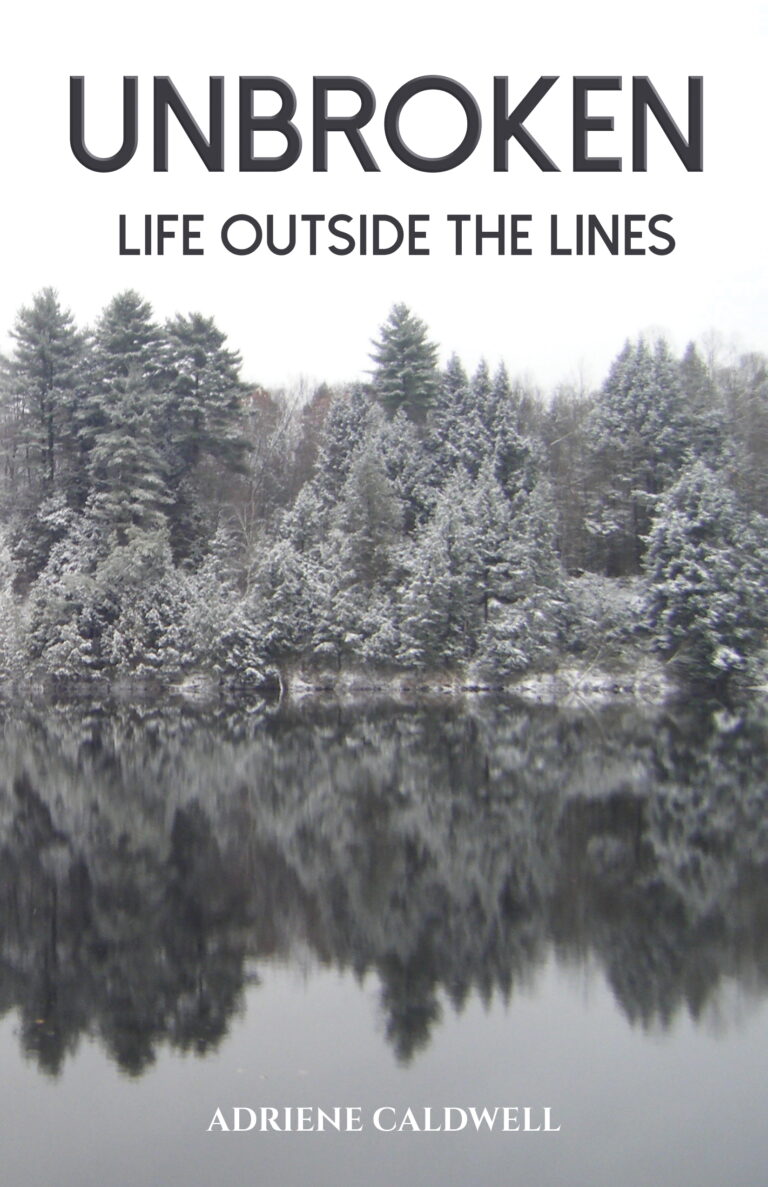 Book cover for Unbroken: Life Outside the Lines by Adriene Caldwell, featuring snow-covered evergreen trees mirrored in a calm lake beneath an overcast sky.