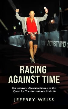 A man in athletic gear raises his arms in victory as he crosses a finish line at night. The book cover reads: Racing Against Time by Jeffrey Weiss, an inspiring tale of Ironman races, ultramarathons, and mid-life transformation.