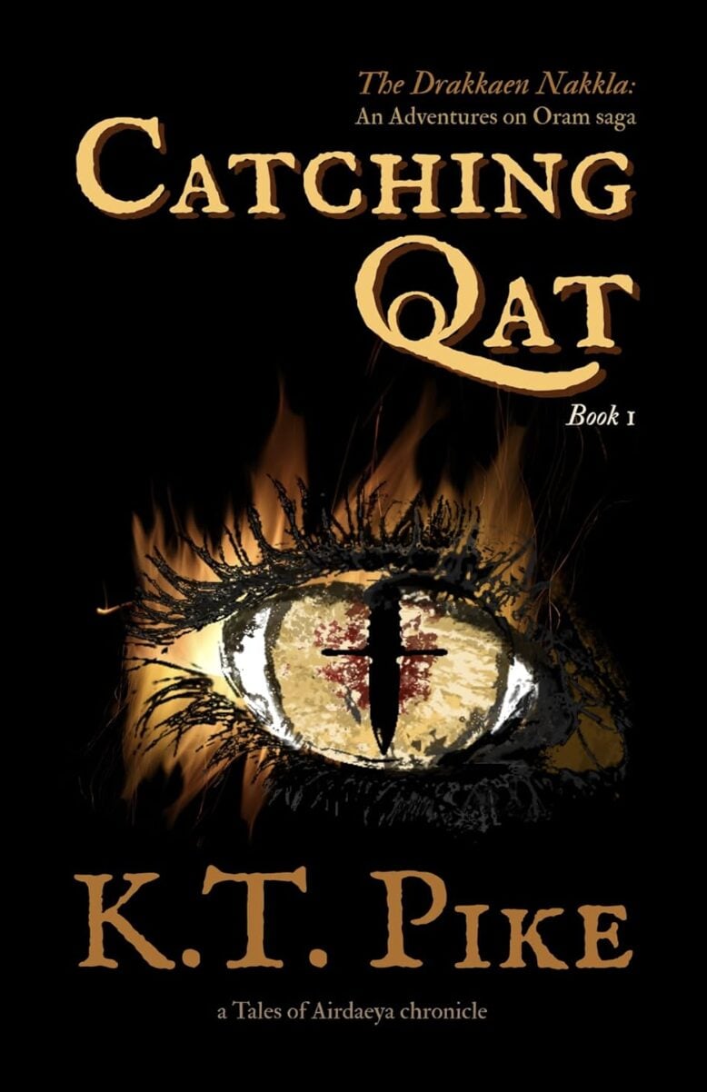 Book cover for Catching Qat by IR Approved Author K.T. Pike features a close-up of a dragon-like eye with fire, gold and orange tones, and fantasy-style text. Subtitles mention Book 1 and An Adventures on Oram saga. No sign of over-edit here!.