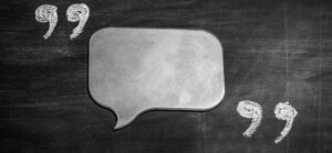 A chalkboard speech bubble symbolizing thoughtful quoting.